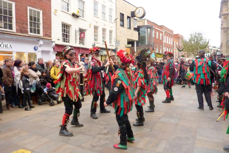 a parade of people dressed in costume