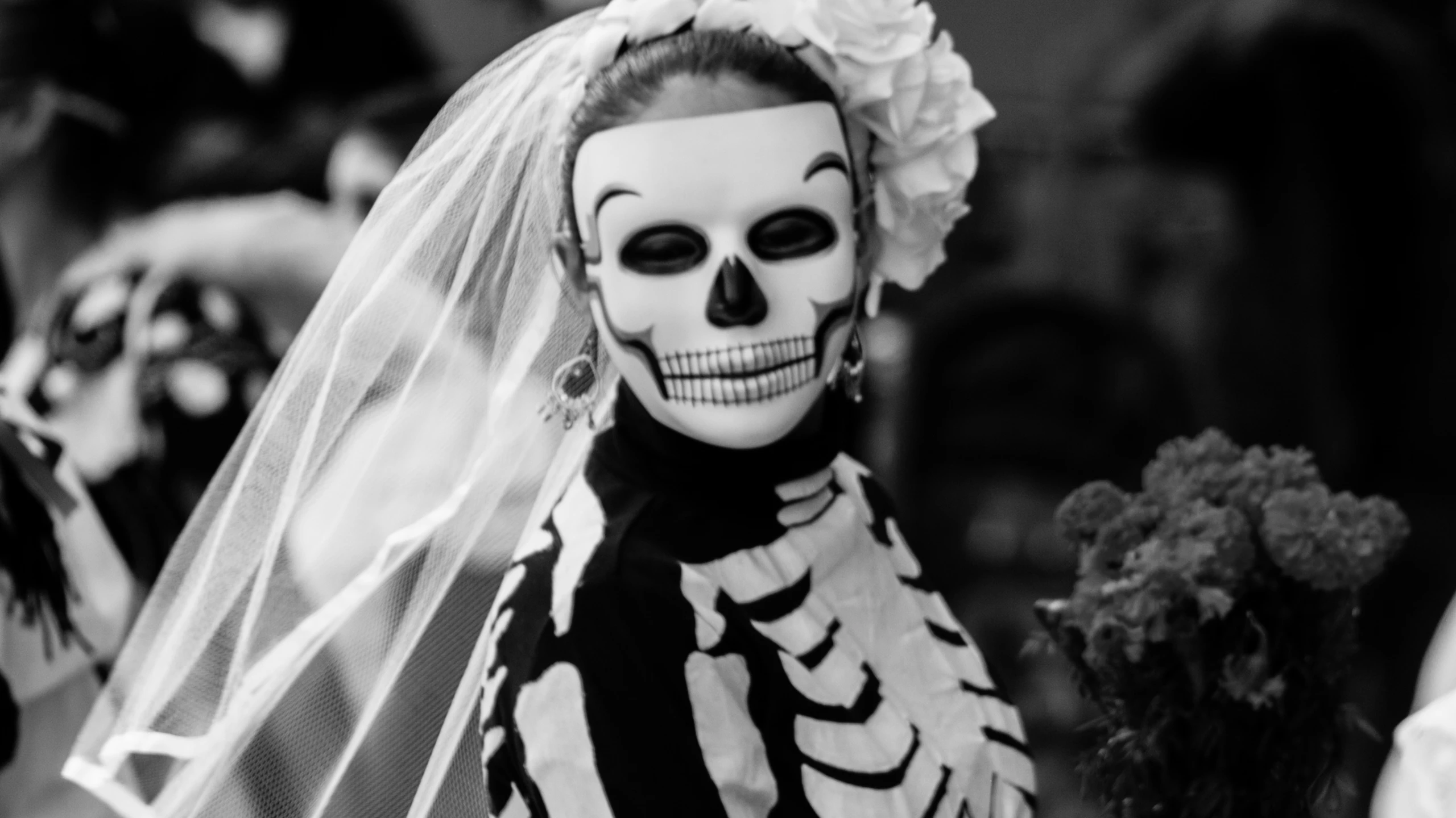 skeleton bride in costume with flower hairpiece