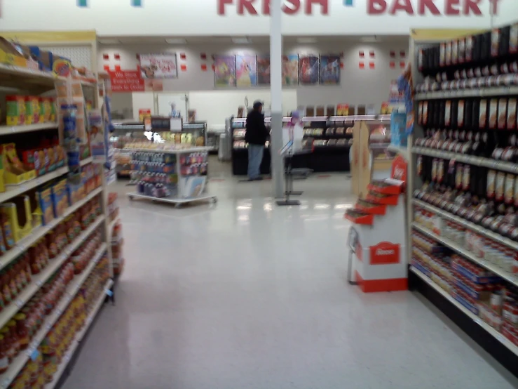 an empty fresh bakery aisle with lots of items