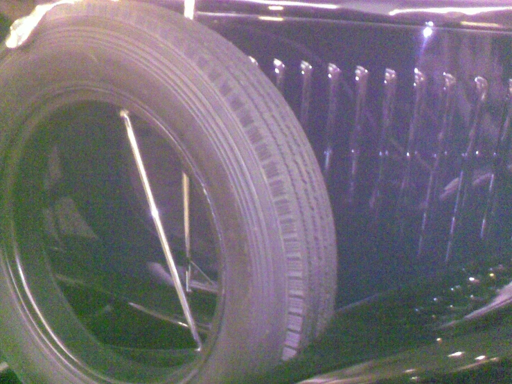 the tire of a classic car displayed in blurry image