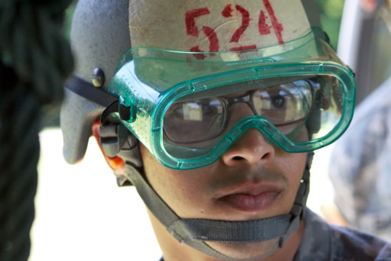 a man wearing glasses and goggles for riding a bicycle