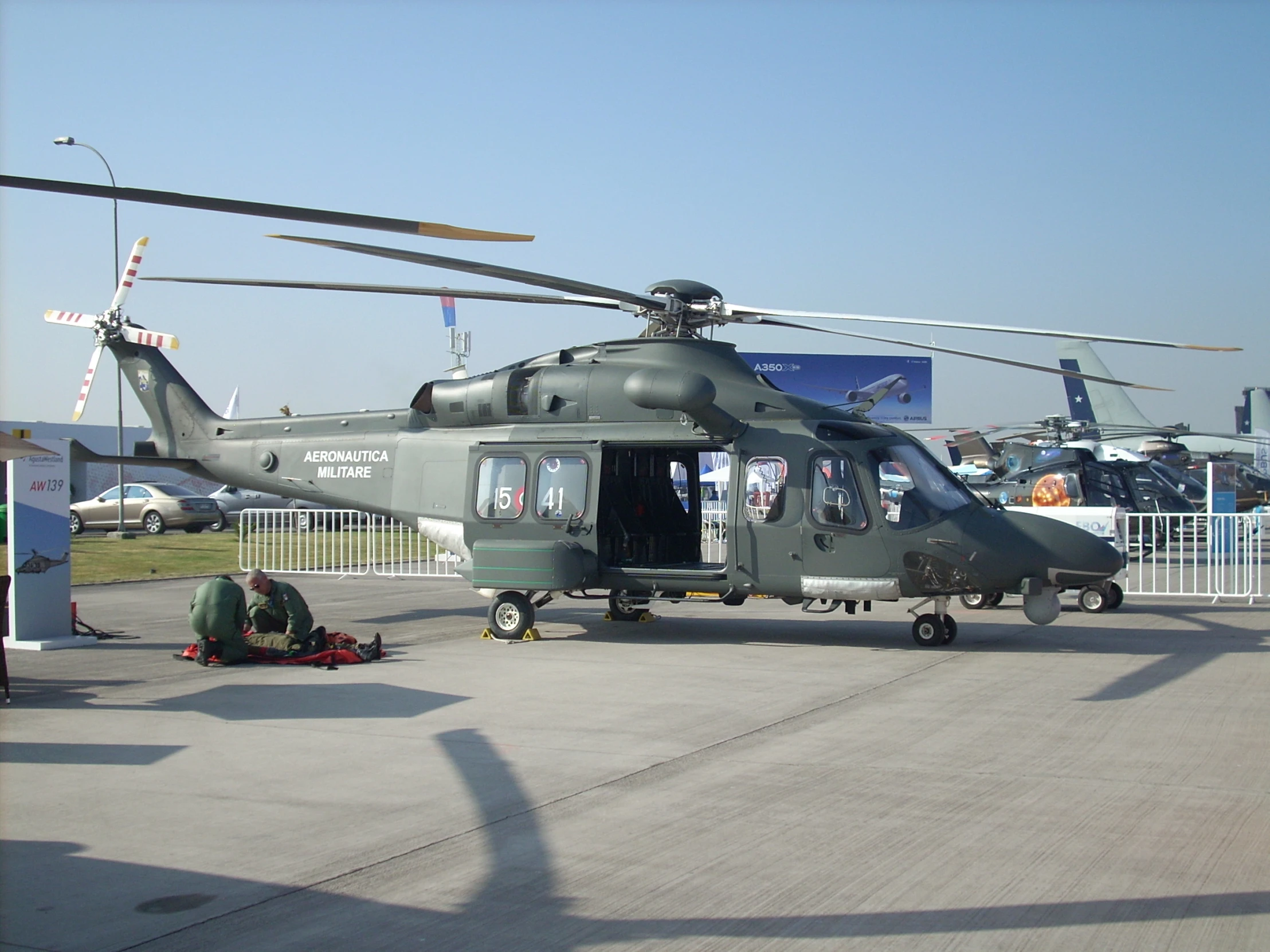 a large helicopter sitting on top of an airport tarmac