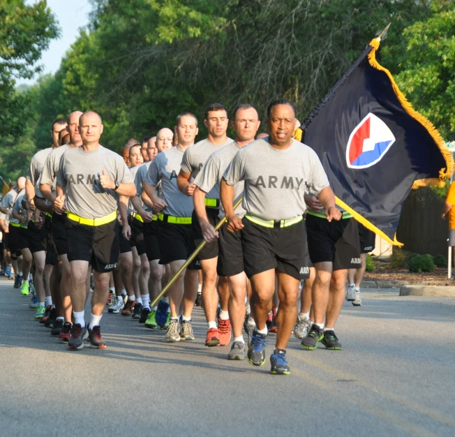 several people are racing down the road together