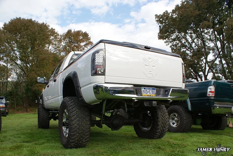 a pick up truck sits parked in the grass