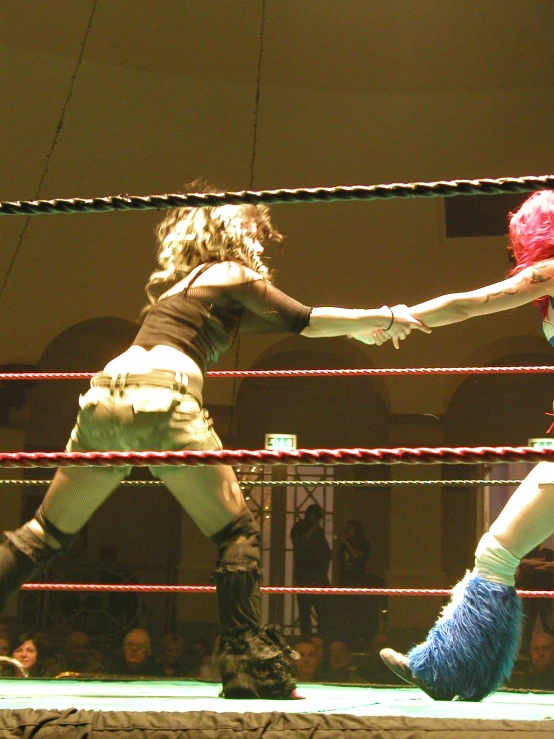 the wrestling is in an air between the two women