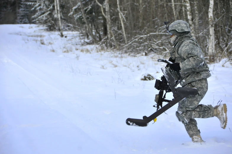 a soldier walking through snow with a rifle in hand
