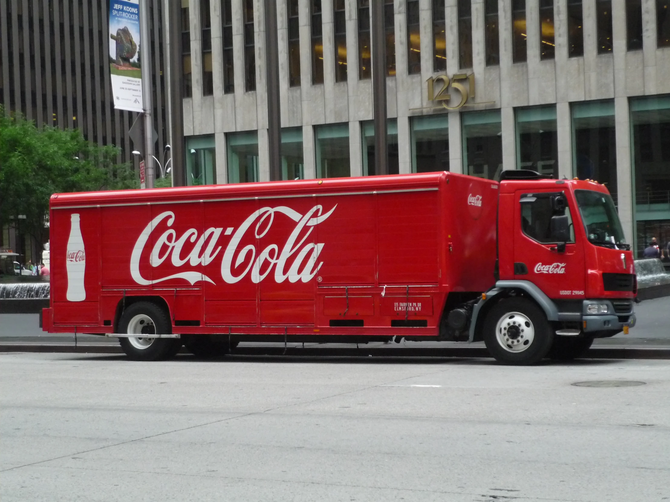 coca cola truck parked on the side of the road