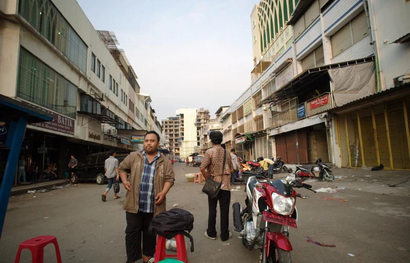 there are two men on the street with bikes