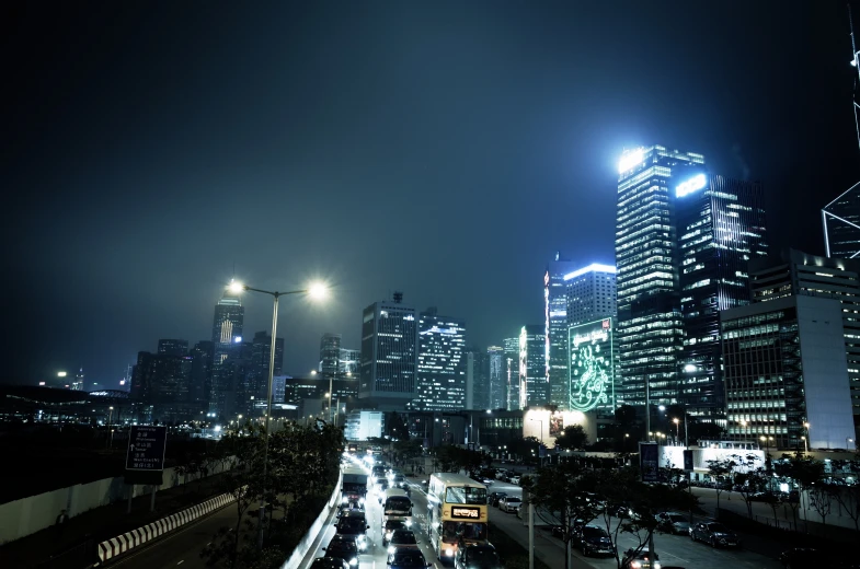 the nighttime view of a highway with traffic