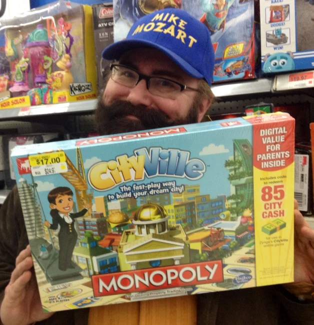 a man wearing a hat holding a board game in a store