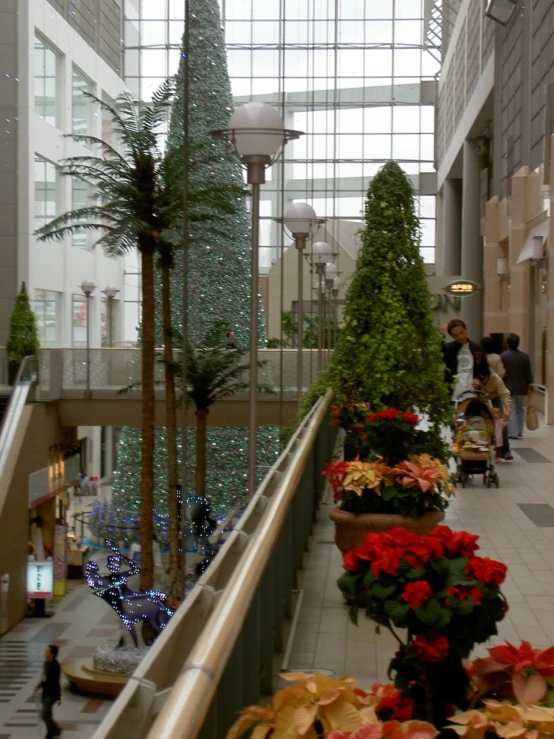 a couple of people standing in a atrium