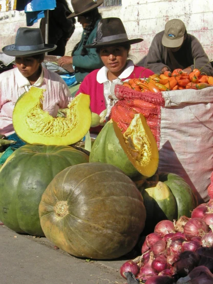 farmers and their produce at the market are smiling