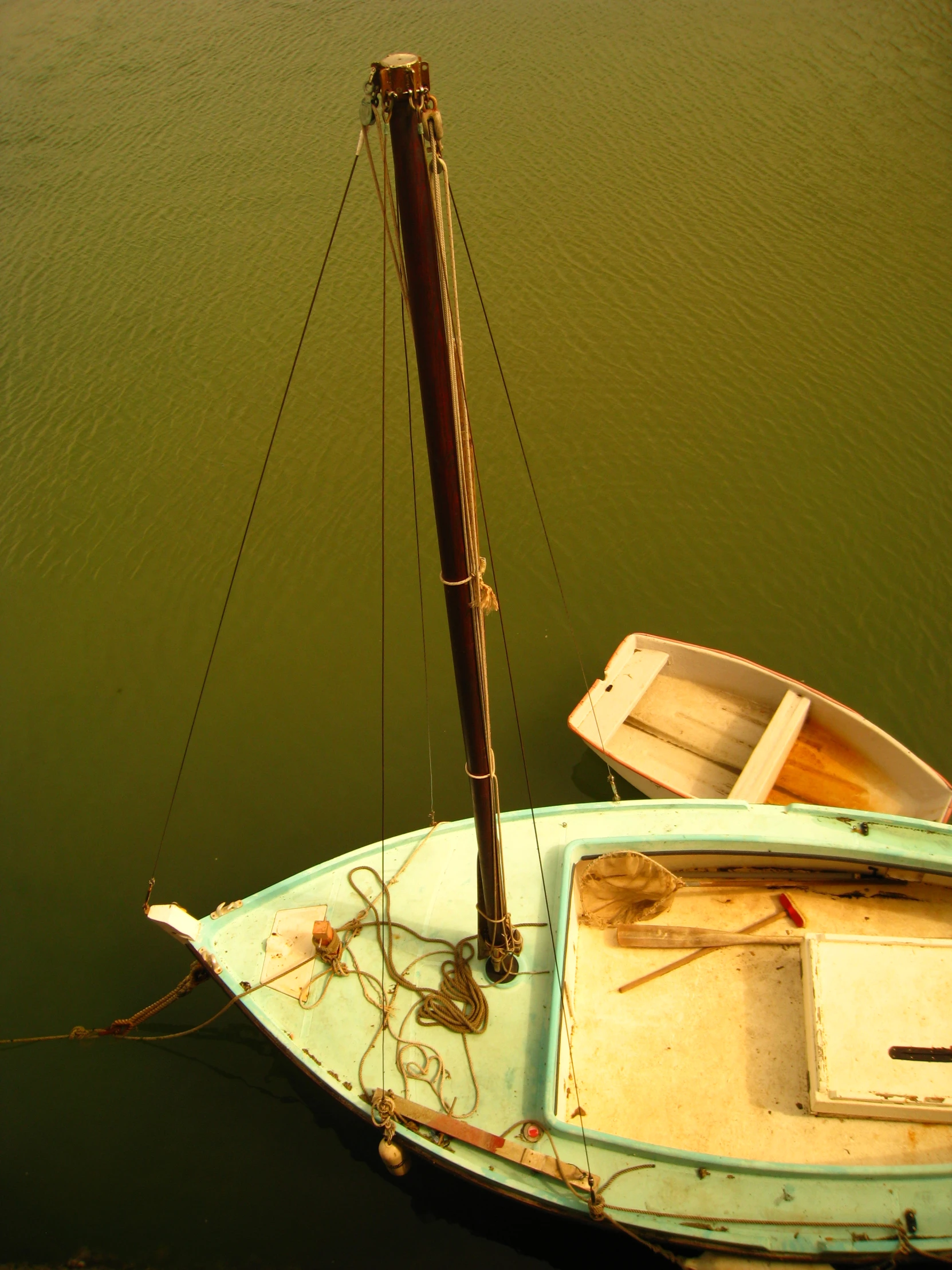 a blue and white boat in the middle of a lake