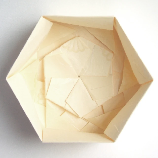 the inside of an octagonal bowl with different shapes and sizes