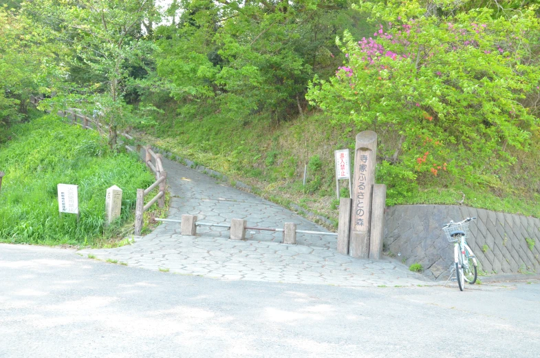 a bike is parked near an open gate