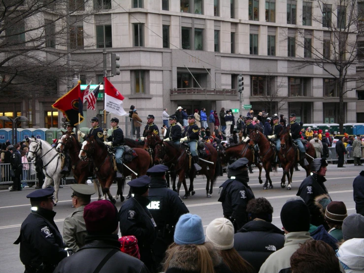 mounted police riding horses down a city street