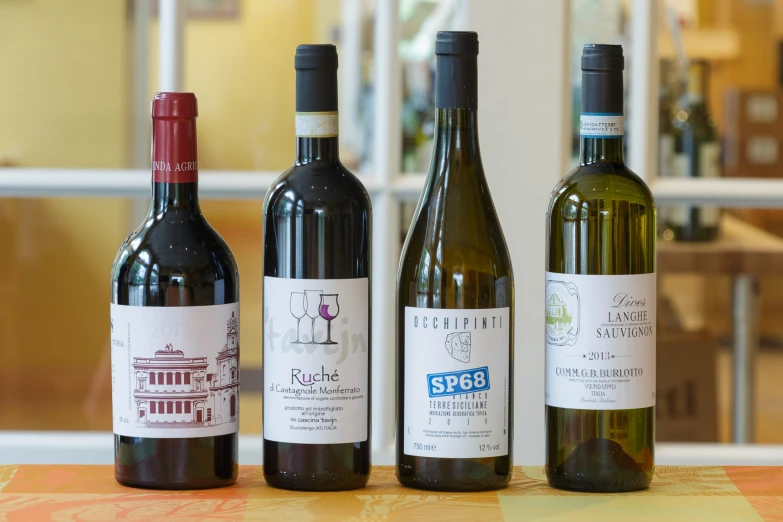 three bottles of wine are shown next to each other