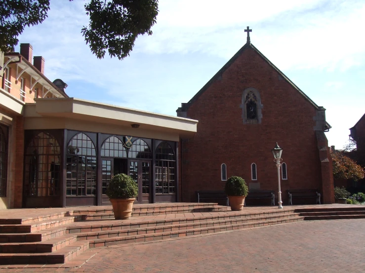 a brick building with steps going up and to it