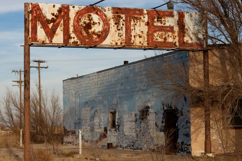 a large sign mounted on the side of an old building