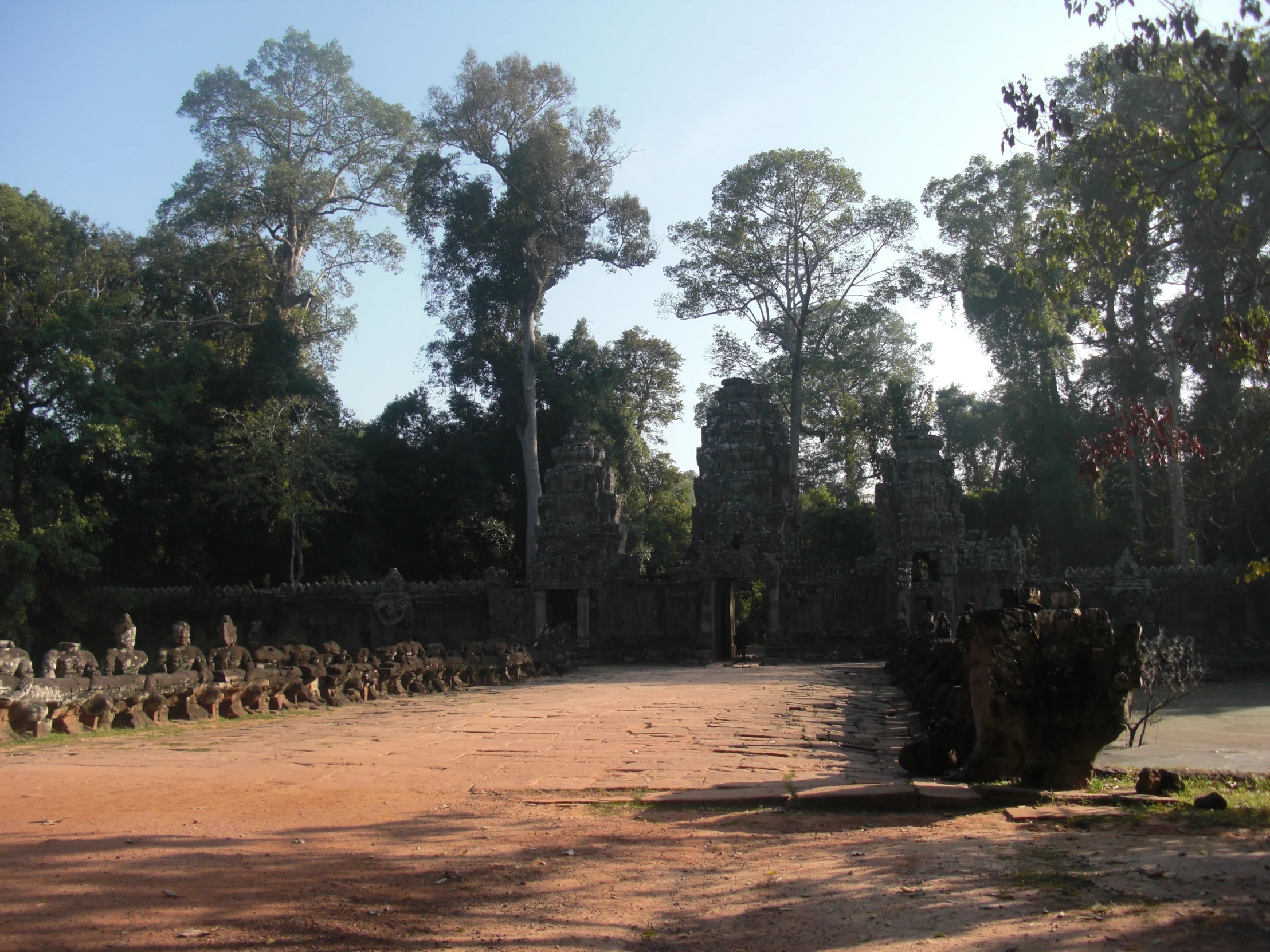 a group of stone structures stand in an empty area