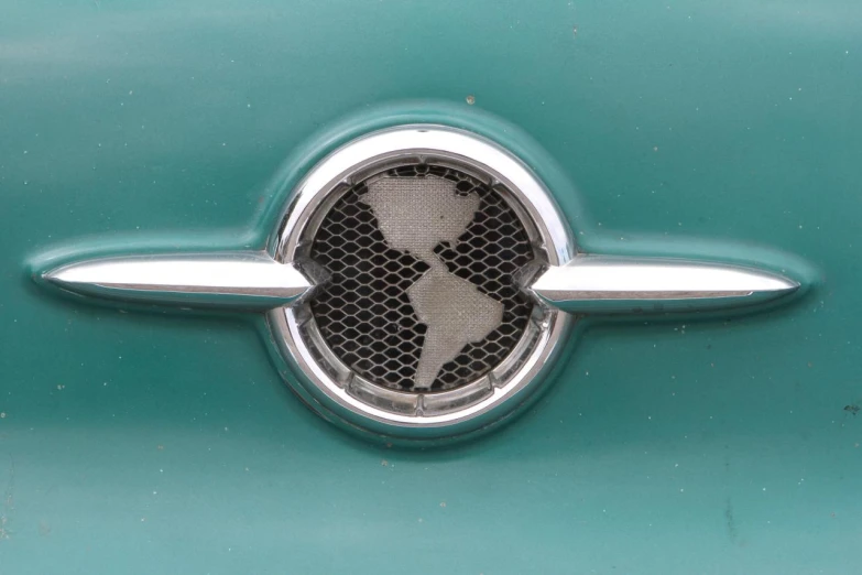 the emblem of a car with a cross on it