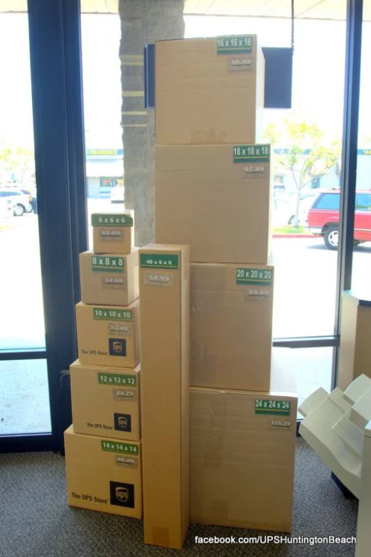several boxes stacked on each other with a window in the background