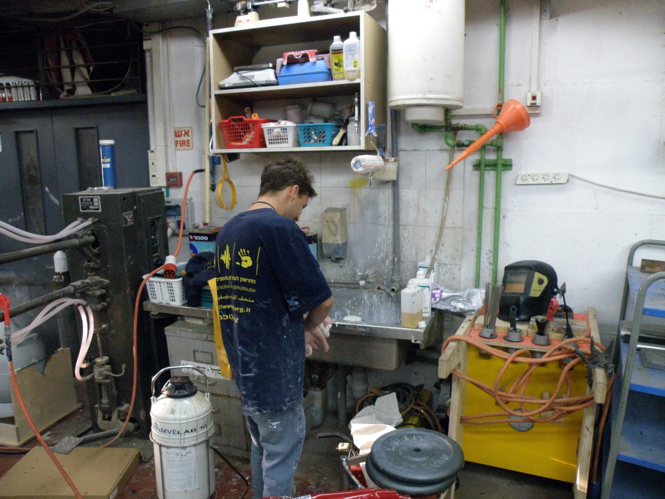 a man is working in a garage setting