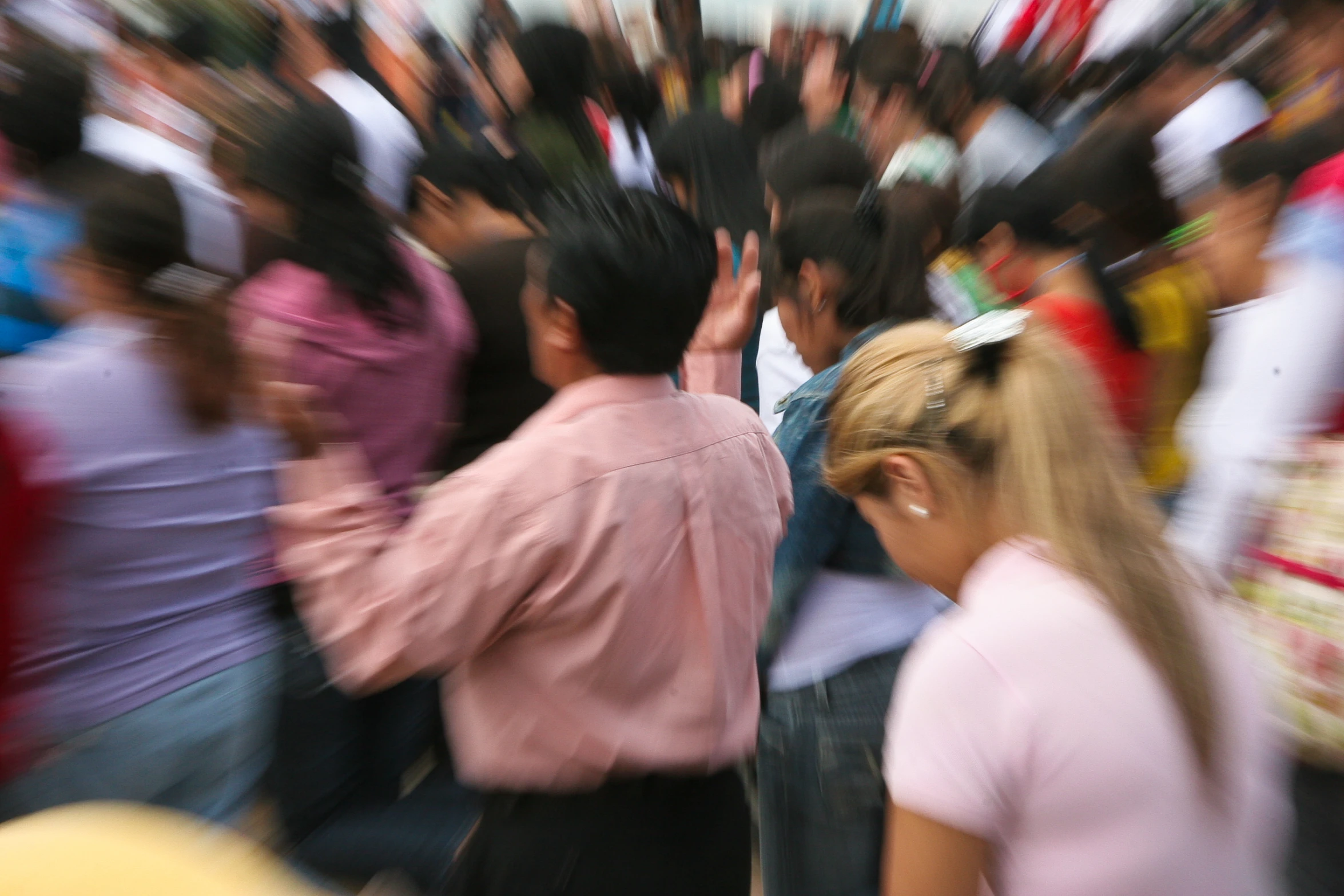 a crowd of people walking along side each other