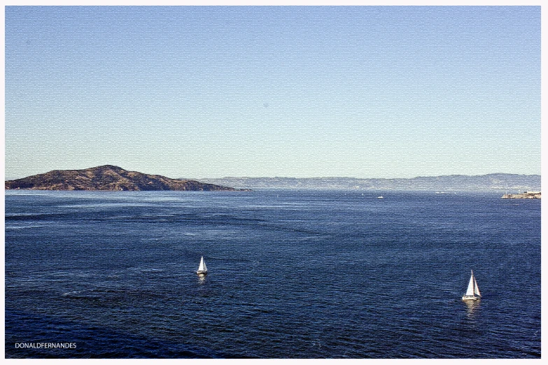 the white sailboats are out on the calm blue water