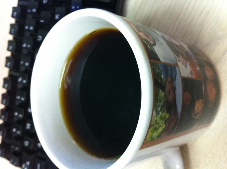 a coffee cup with a liquid in it sits on the table