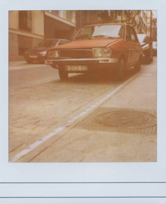 an old red van parked on the side of the street