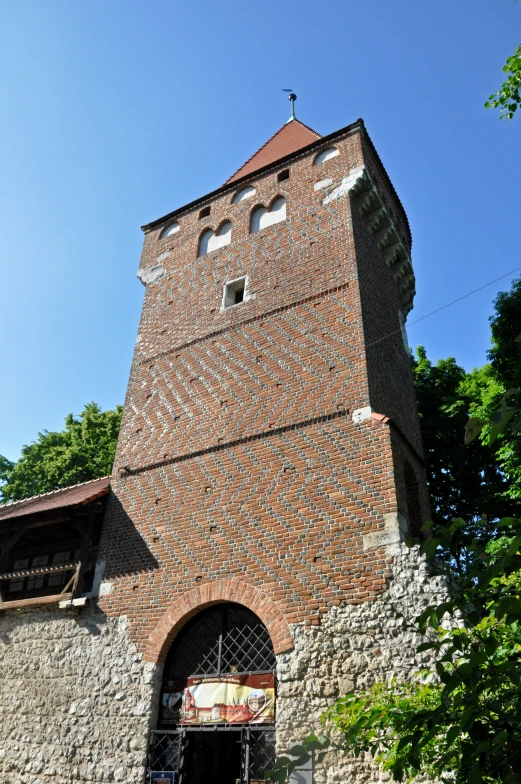 an old brick tower with a clock on top