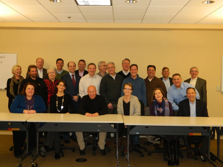 a group of people who are standing in front of a table