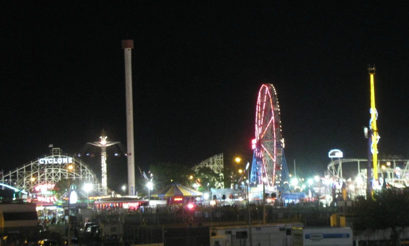 a ferris wheel sitting at the end of a carnival ride