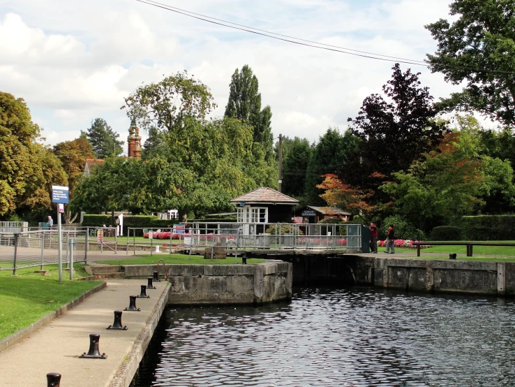 a lake with a gazebo sitting at the end