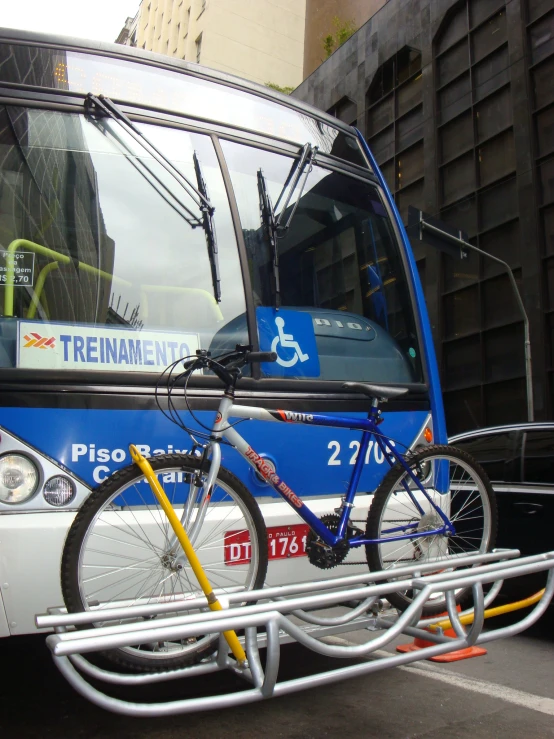 there is a bicycle on the front rack of a bus