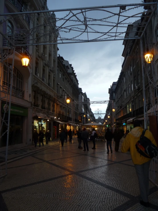 a busy city with pedestrians and walking lights