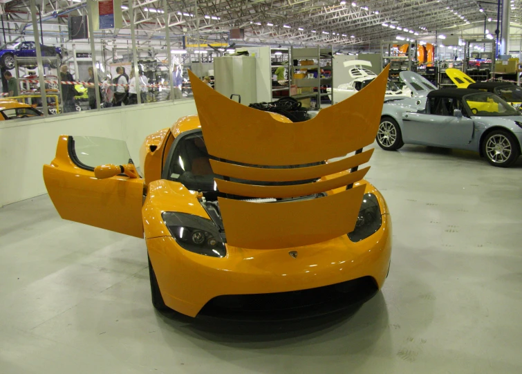 the car is being displayed in the factory