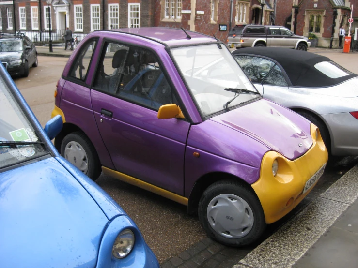 a car that has been decorated with the colors of purple and orange