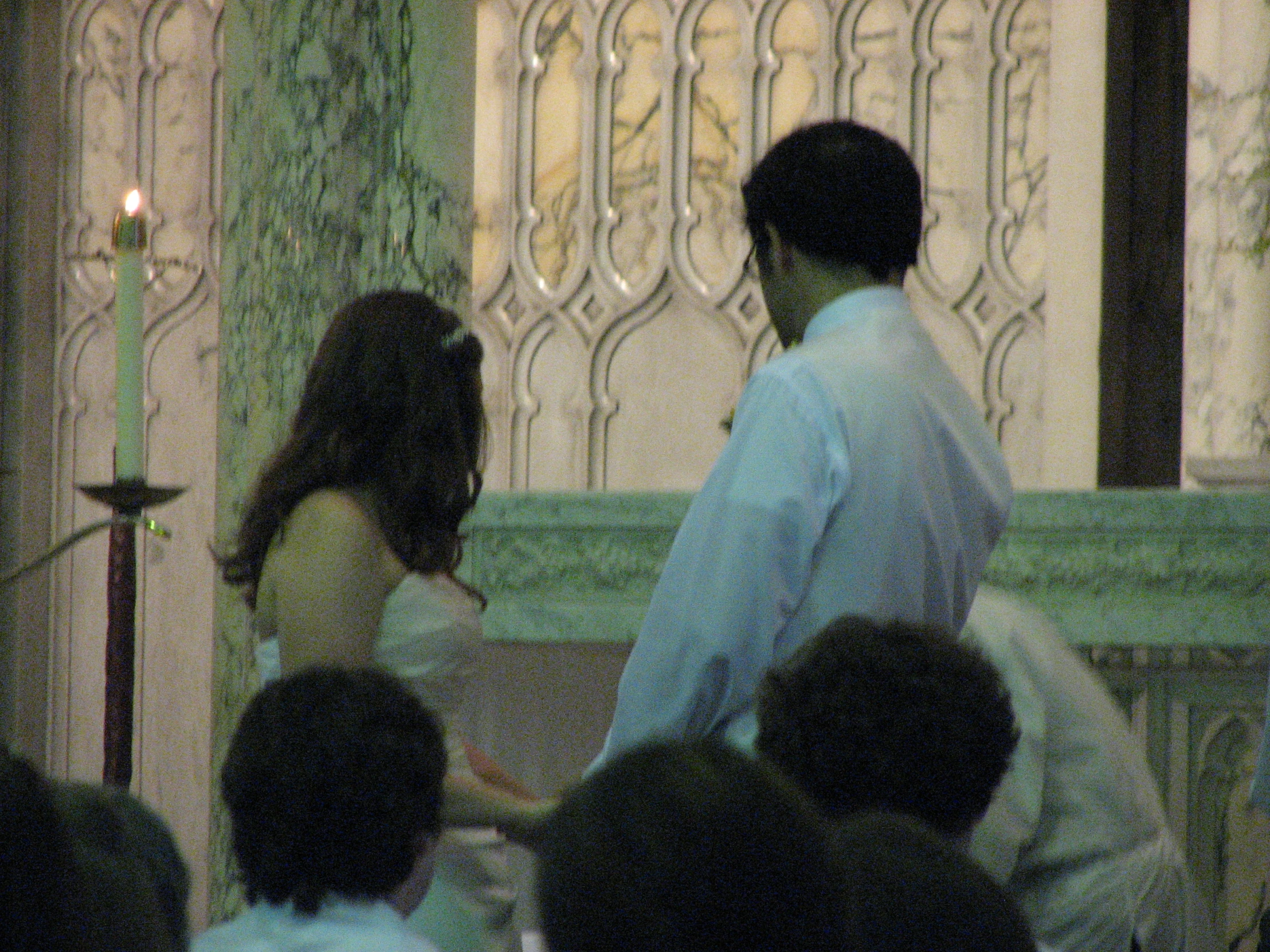 people are sitting on the pews in a church