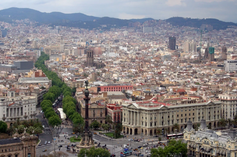 a city with mountains in the distance