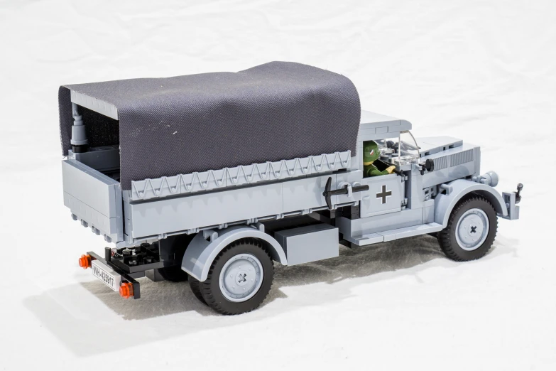 a model military vehicle is shown on the white surface