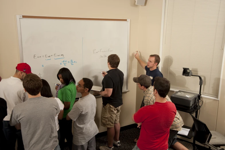 two men teaching a class to children