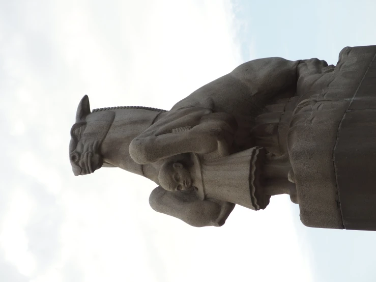 a statue is shown with an umbrella flying through the sky