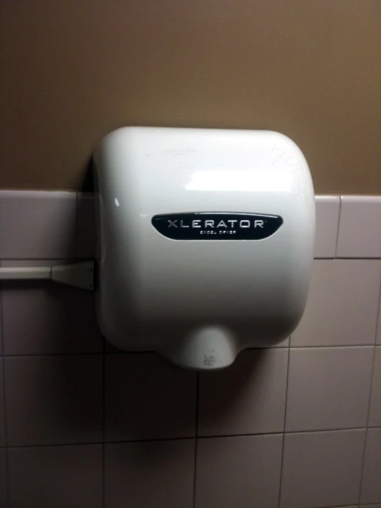 a urinal attached to the wall in a bathroom