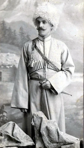 a historical po of a man in uniform with a rifle