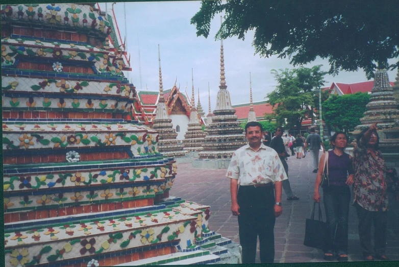 a man and two women standing next to each other