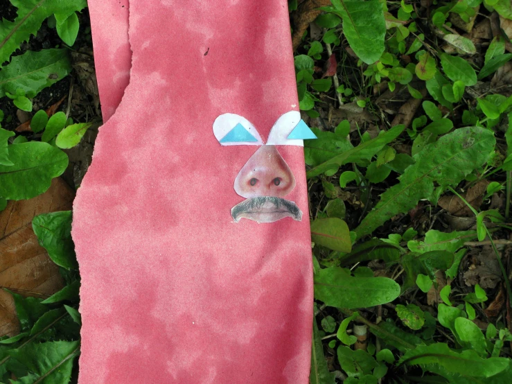 a pink towel with a sticker on it