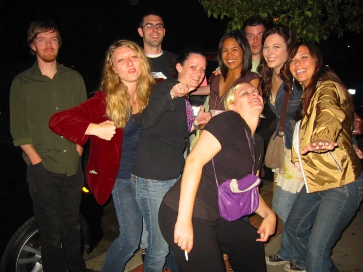 a group of people standing in the street