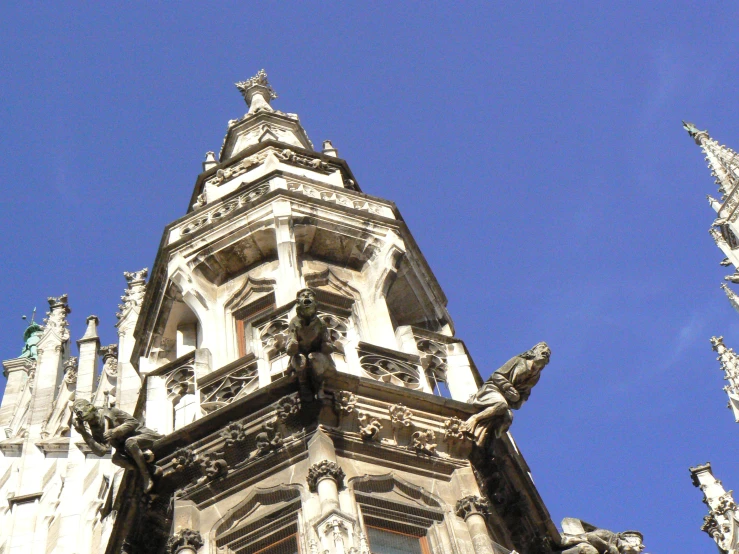 the top of a gothic - looking building features an intricate design